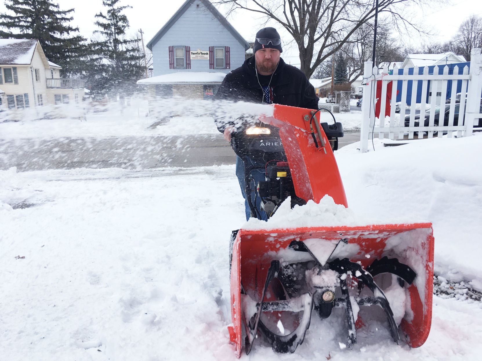 Jason Houdek uses snow-blower in Union Grove
